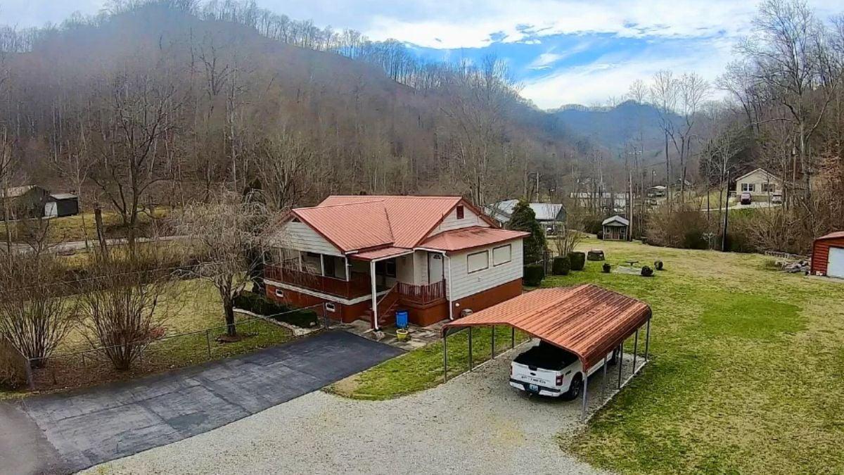 Country Home Nestled in Nature With a Standout Red Roof