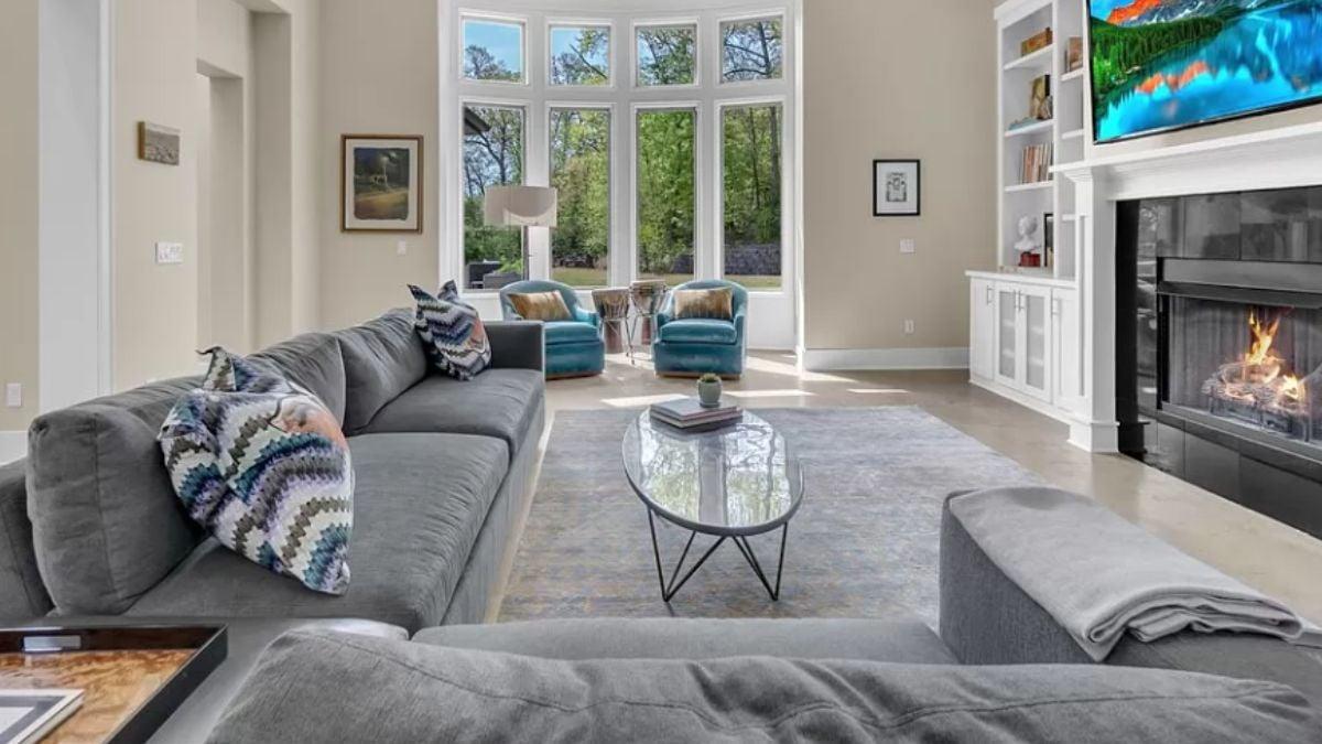 Grand Living Room with Huge Windows Overlooking Nature