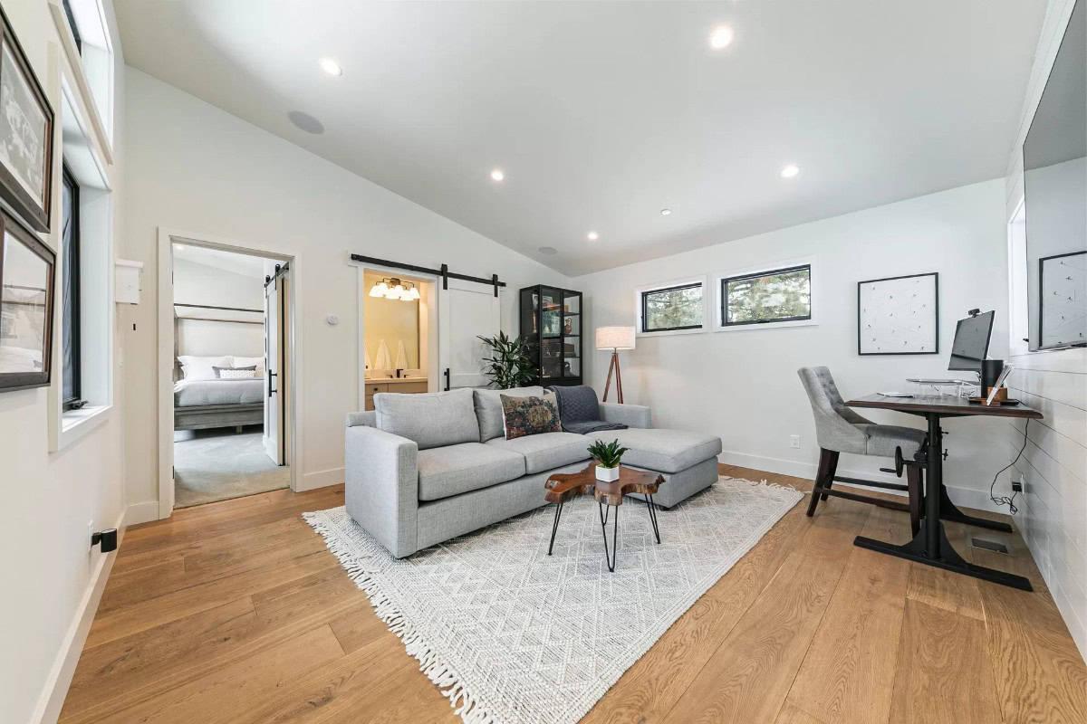 Spot the Sliding Barn Door That Adds Character to This Multipurpose Living Area