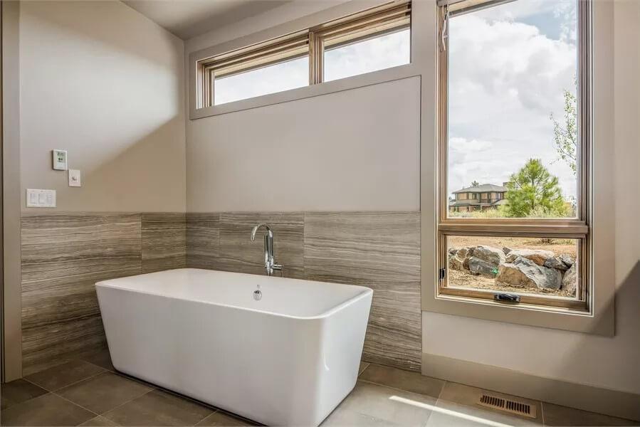 See How This Minimalist Bathroom Features a Freestanding Tub with a View