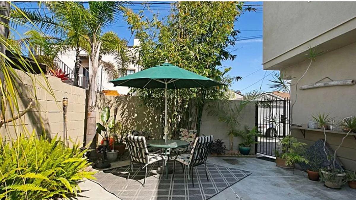 Charming Courtyard with a Tropical Flair and Shaded Alcove