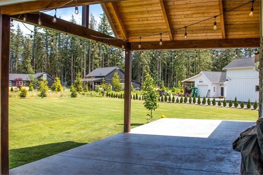 Step Out to This Expansive Covered Patio with String Lights