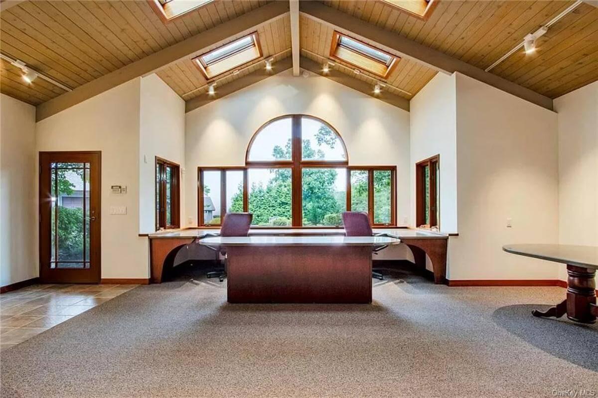 Notice the Wooden Ceiling and Skylights Bringing Natural Light into This Office