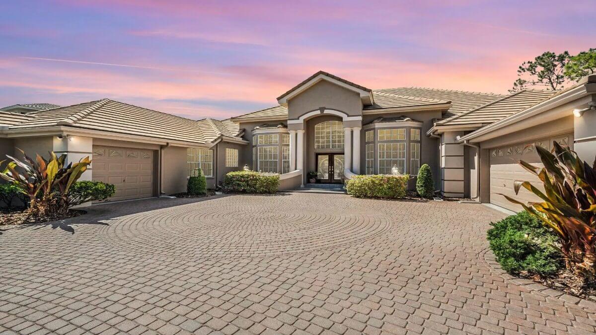Check Out the Grand Entrance with Dual Columns and Herringbone Driveway