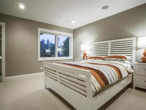 Relax in a Tranquil Bedroom Featuring Striped Bedding