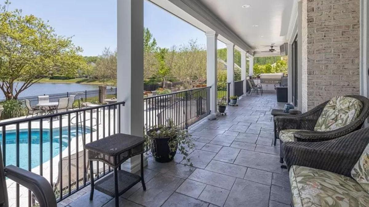 Spacious Covered Patio Overlooking a Peaceful Poolside View