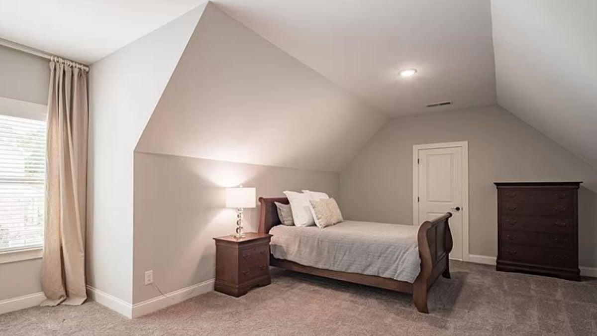 Understated Bedroom with a Sloped Ceiling Adding Character