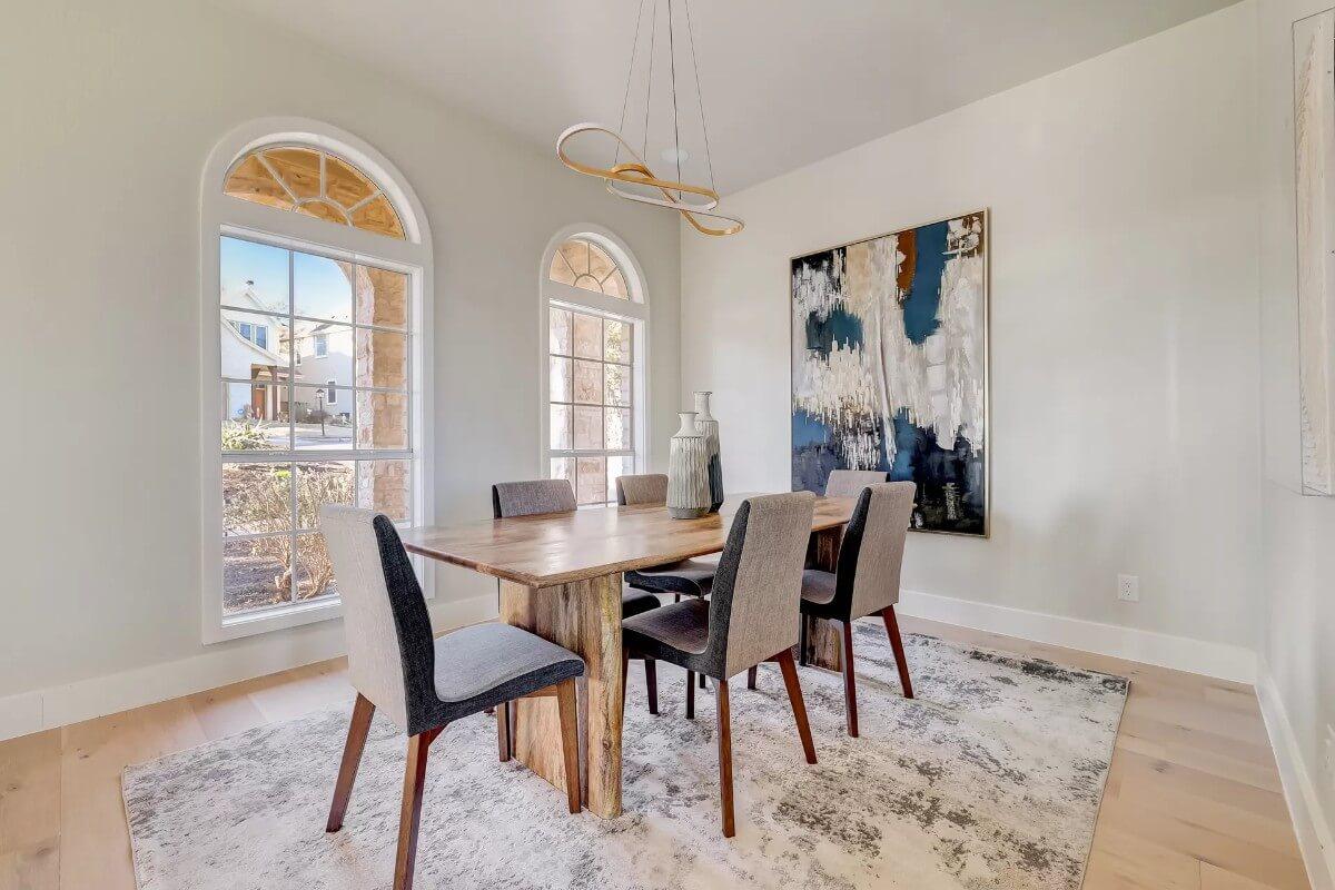 Check Out the Unique Light Fixture in This Elegant Dining Room