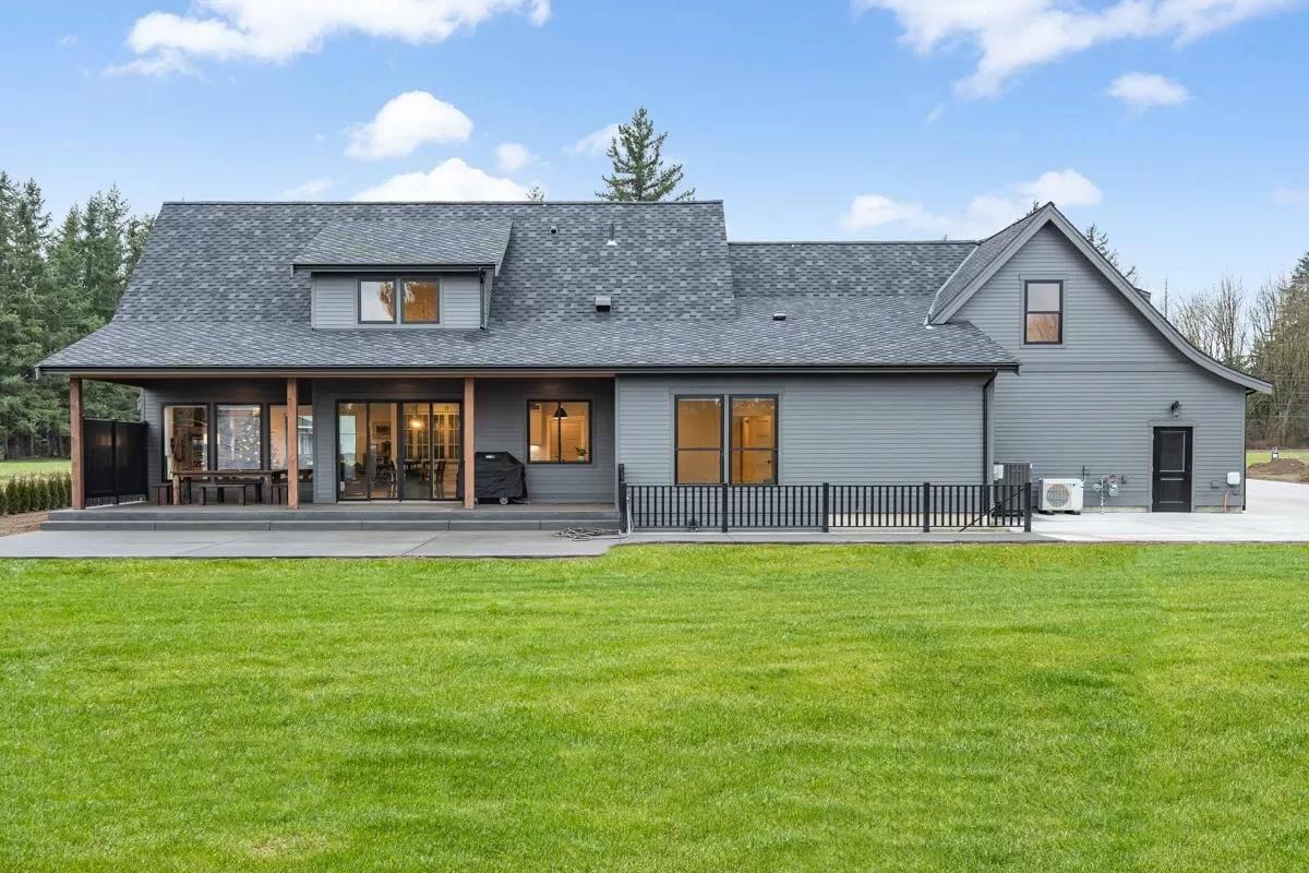 Modern Farmhouse Exterior with an Inviting Wraparound Patio