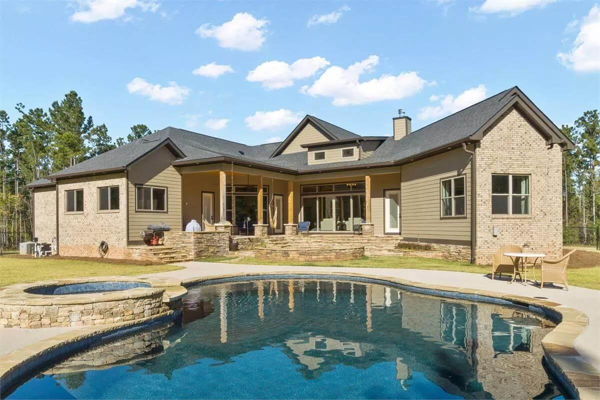 Explore the Inviting Outdoor Living Space with a Poolside Retreat