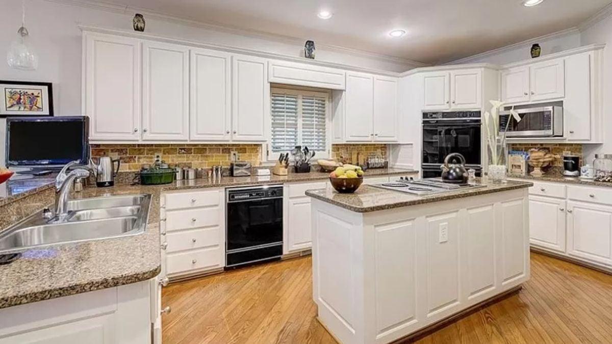 Spacious Kitchen with Central Island and Granite Countertops