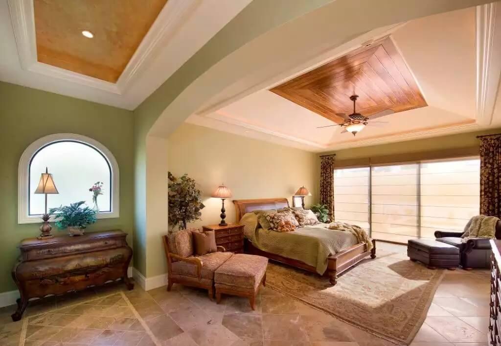 Relax in This Stunning Bedroom with a Tray Ceiling and Natural Light