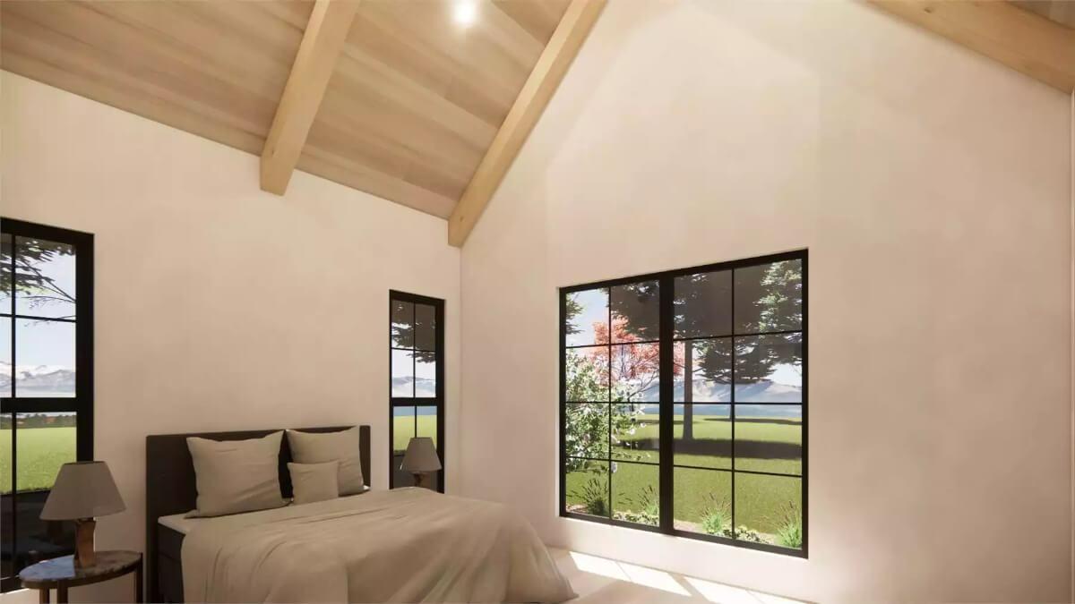 Take in the Vaulted Ceilings and Expansive Windows in This Serene Bedroom