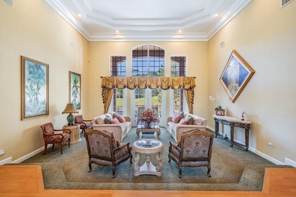 Grand Living Room with High Ceilings and Opulent Drapery