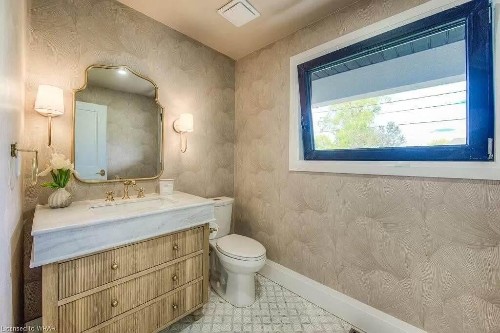 Elegant Powder Room Featuring a Stunning Marble Vanity