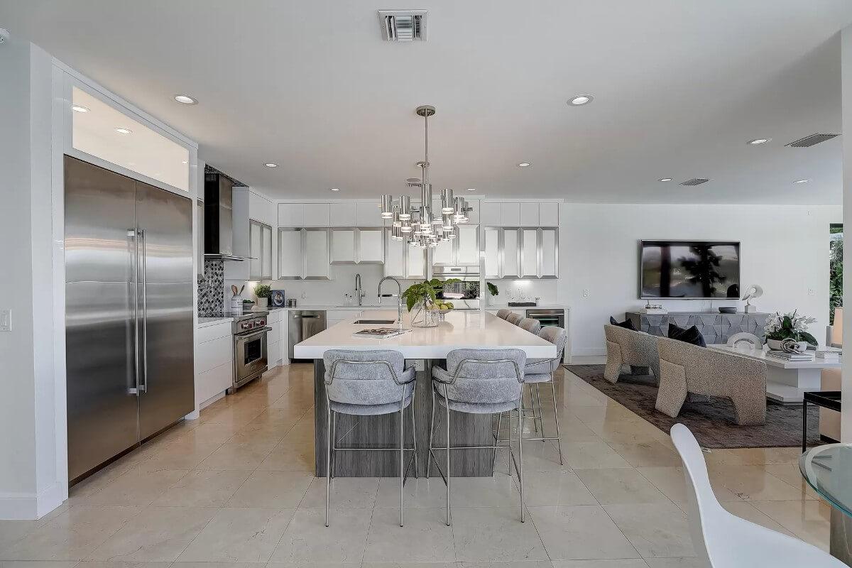 Notice the Stunning Chandelier Over This Expansive Island