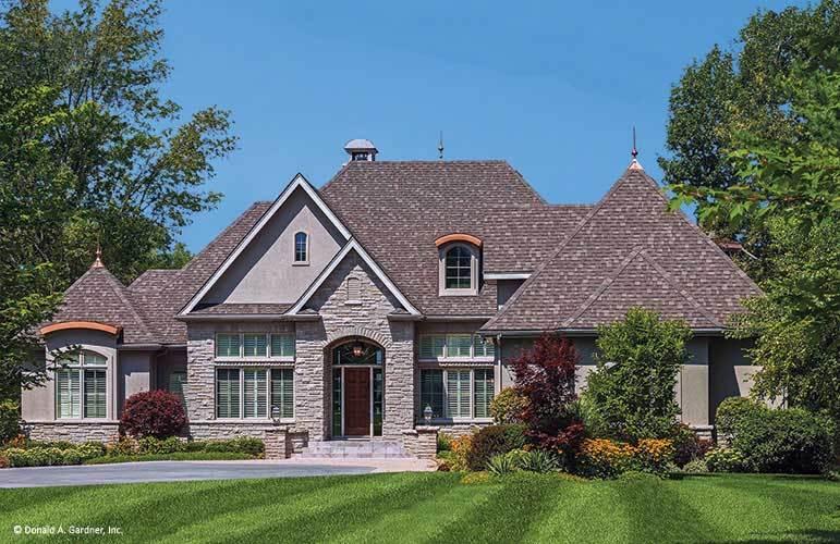 Elegant Stone Facade with Intricate Rooflines in a 3 Bedroom Home