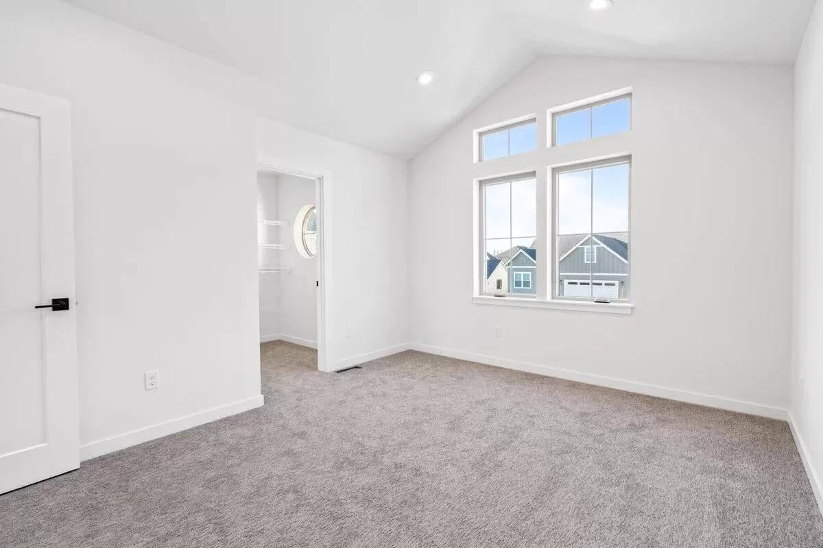 Vaulted Ceilings and Oversized Windows Make This Room Shine