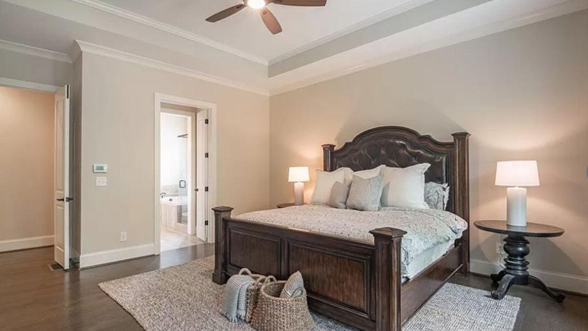 Classic Bedroom Featuring a Statement Carved Bed