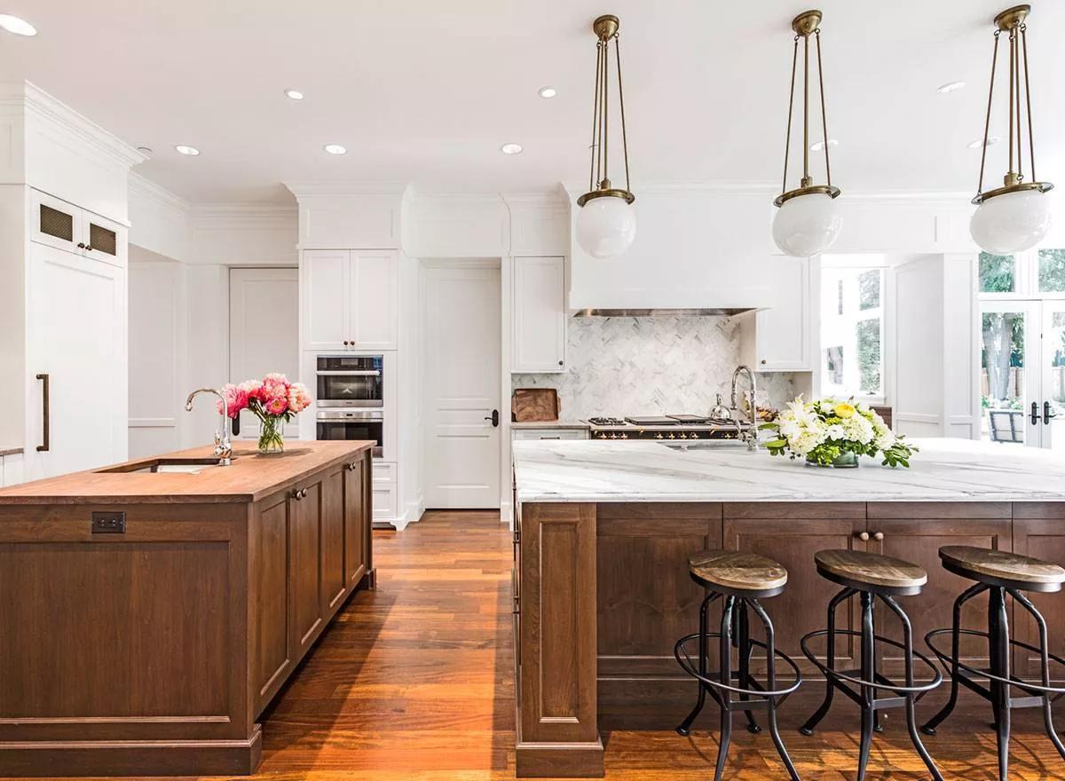 Look at Those Marble Countertops and Rich Wood Accents in This Inviting Kitchen