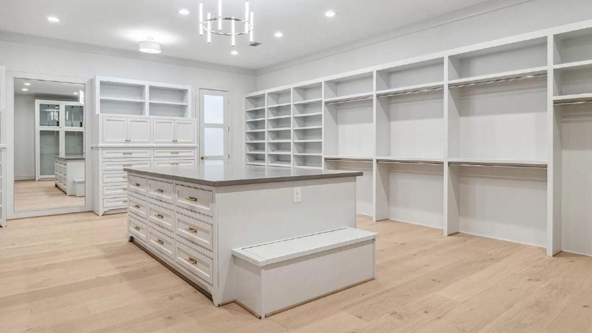 Wow, Look at the Impressive Island With Ample Storage in This Walk-In Closet