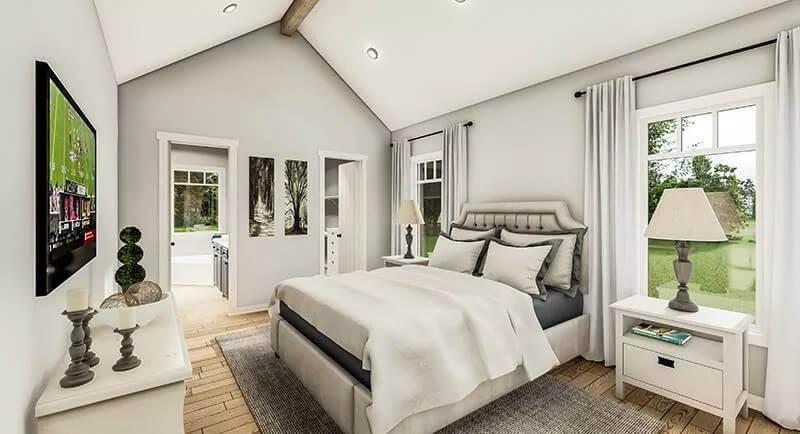 Bedroom Bliss with Vaulted Ceilings and Natural Views
