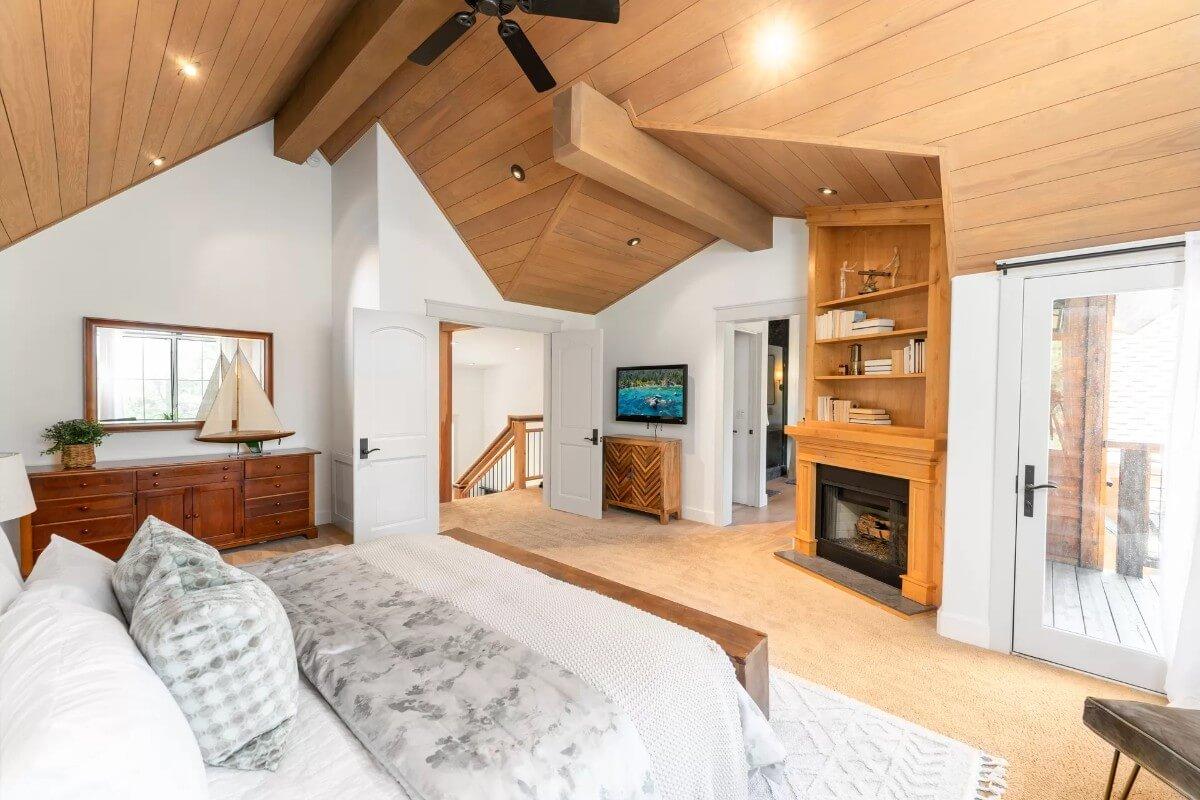 Notice the Vaulted Ceiling and Wooden Beams in This Cozy Bedroom Retreat
