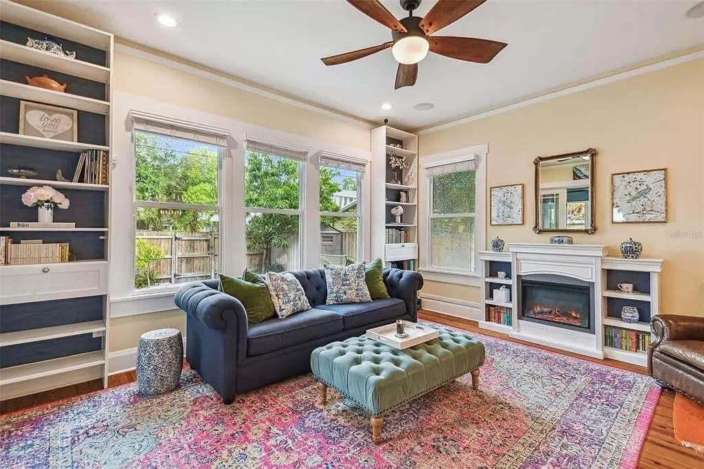 Craftsman Living Room with an Inviting Fireplace and Unique Tufted Ottoman