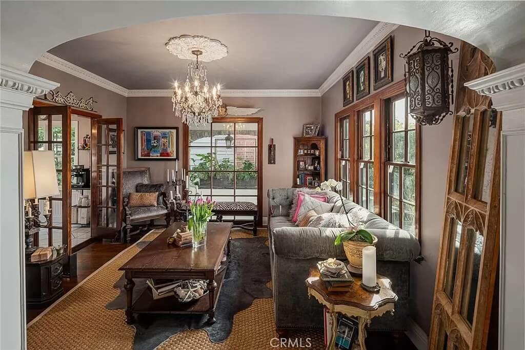 Eclectic Living Room with Vintage Charm and Elegant Chandelier