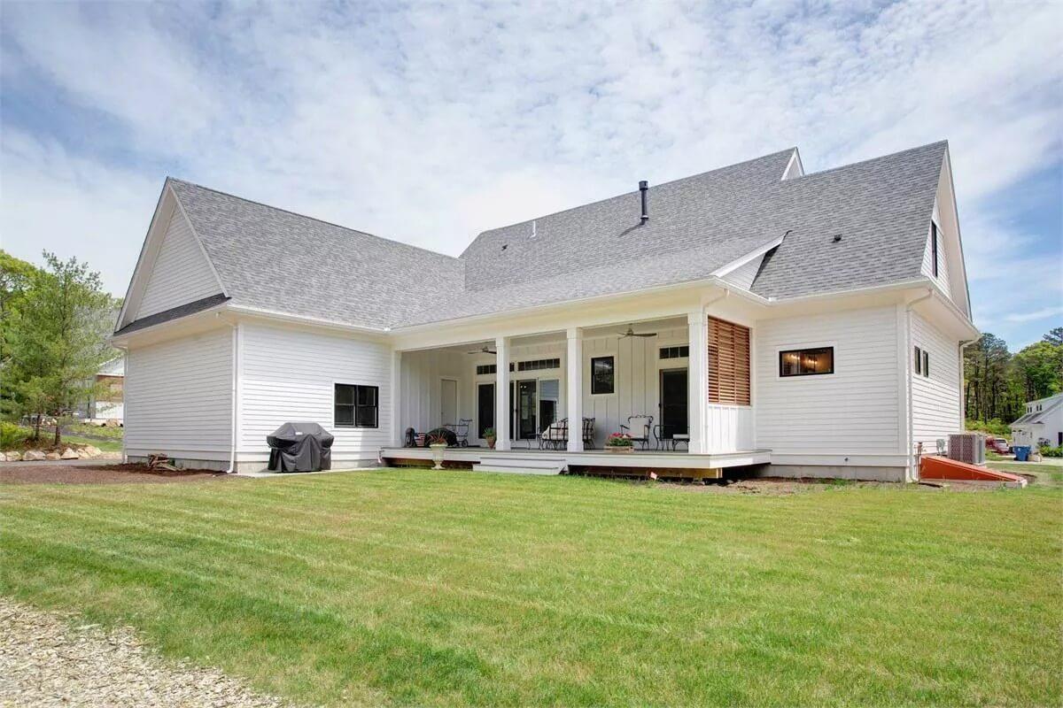 Step Onto This Spacious Back Porch, Perfect for Relaxation