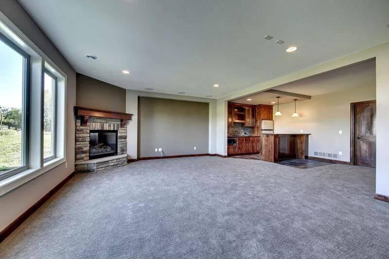 Spacious Craftsman Living Room with Stone-Accented Fireplace