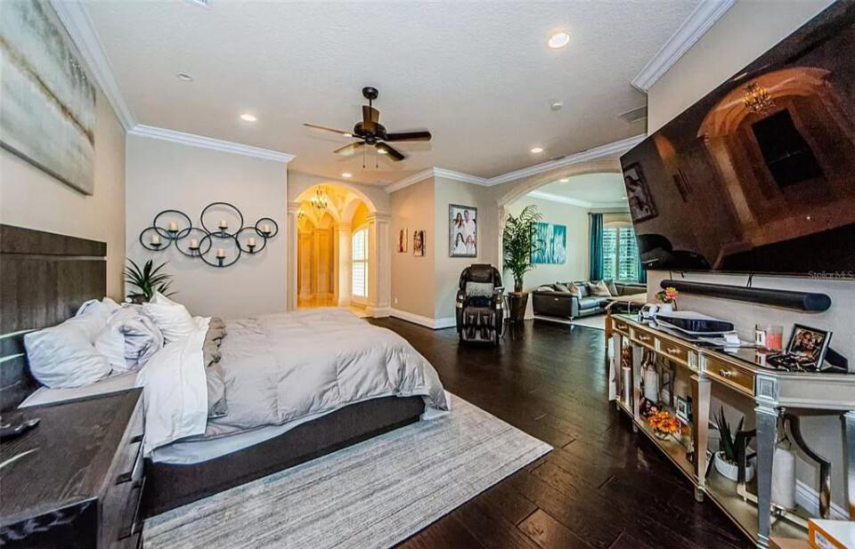 Look at This Spacious Master Bedroom with a Massive Entertainment Setup