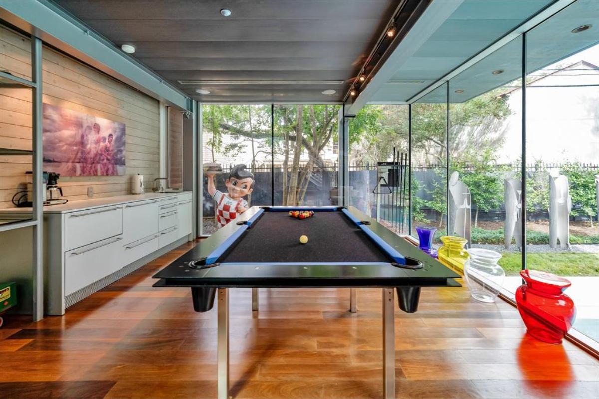 Unique Game Room with Glass Walls and Colorful Vases