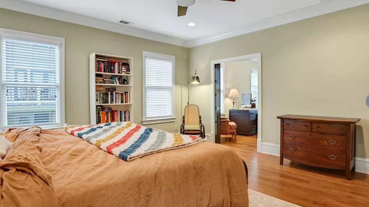 Craftsman Bedroom with a Snug Quilted Blanket and Handy Bookshelf