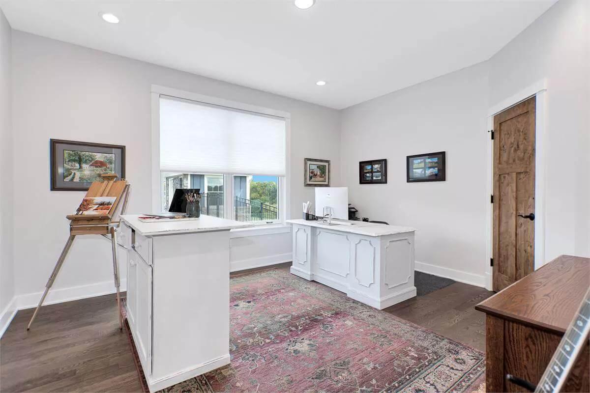 Notice the Charming Vintage Rug Anchoring This Home Office