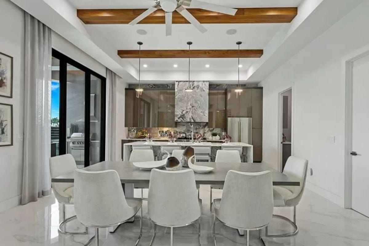 Sleek Dining Area with Attention-Grabbing Exposed Beams