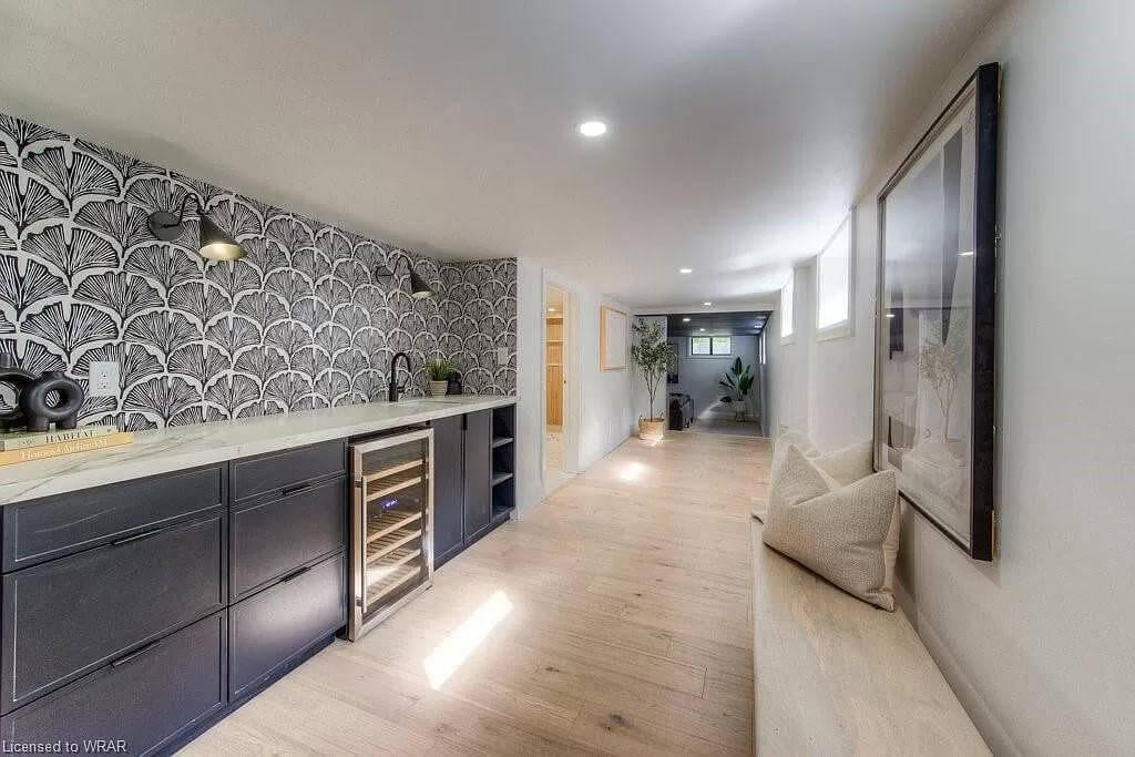 Notice the Statement Wallpaper and Streamlined Cabinets in This Hallway Bar