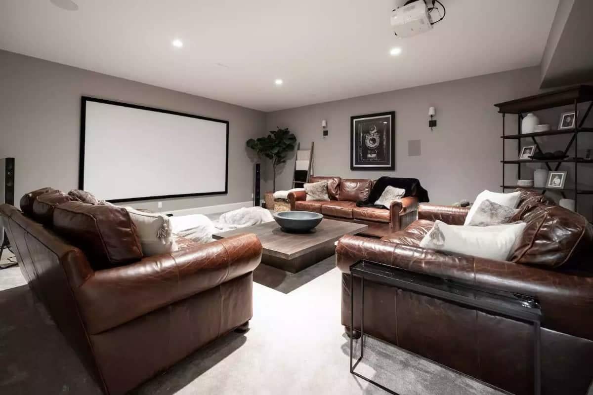 Experience the Luxury of Leather Seating in This Home Theater Retreat