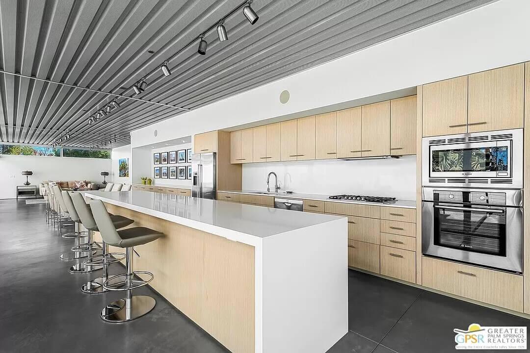 Spacious Kitchen with a Sleek, Minimalist Island and Track Lighting