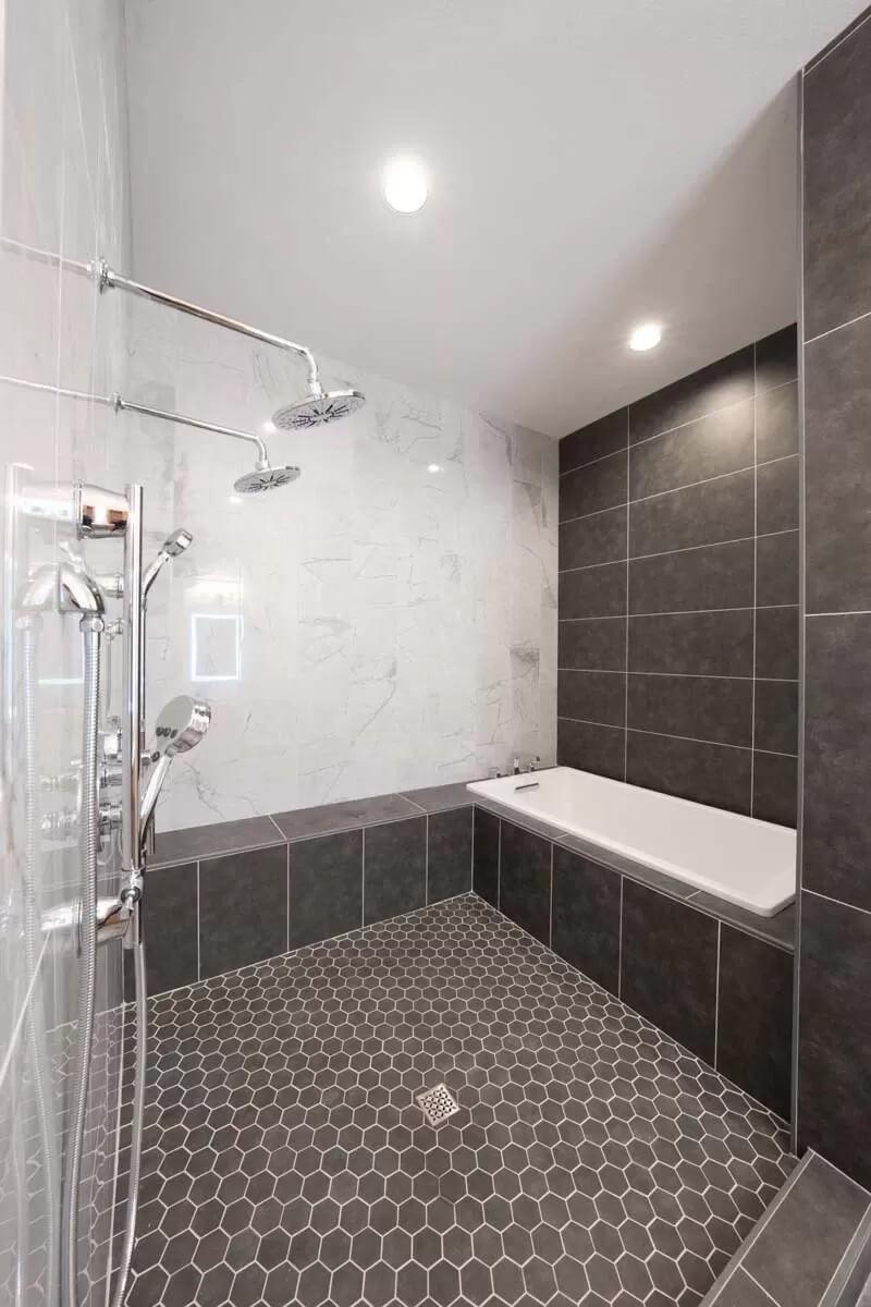 Explore the Modern Elegance of This Dual Shower and Tub Setup