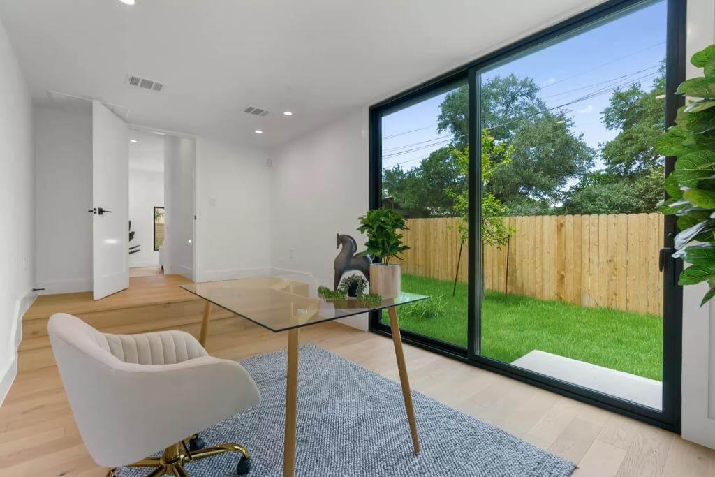 Take in the Floor-to-Ceiling Windows in This Bright Home Office