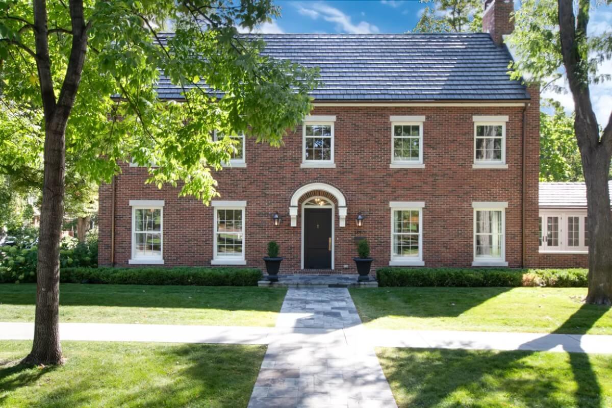 Notice the Crisp Symmetry of This Brick Facade With Its Arched Entryway