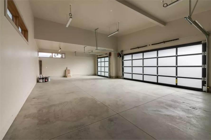 Expansive Garage with Frosted Glass Doors Enhancing Light and Privacy