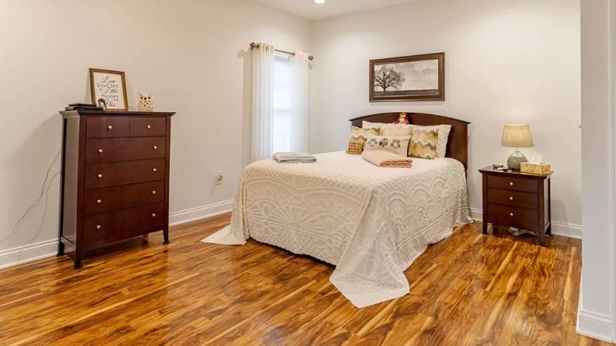 Cozy Bedroom with Warm Wooden Flooring and Classic Touches