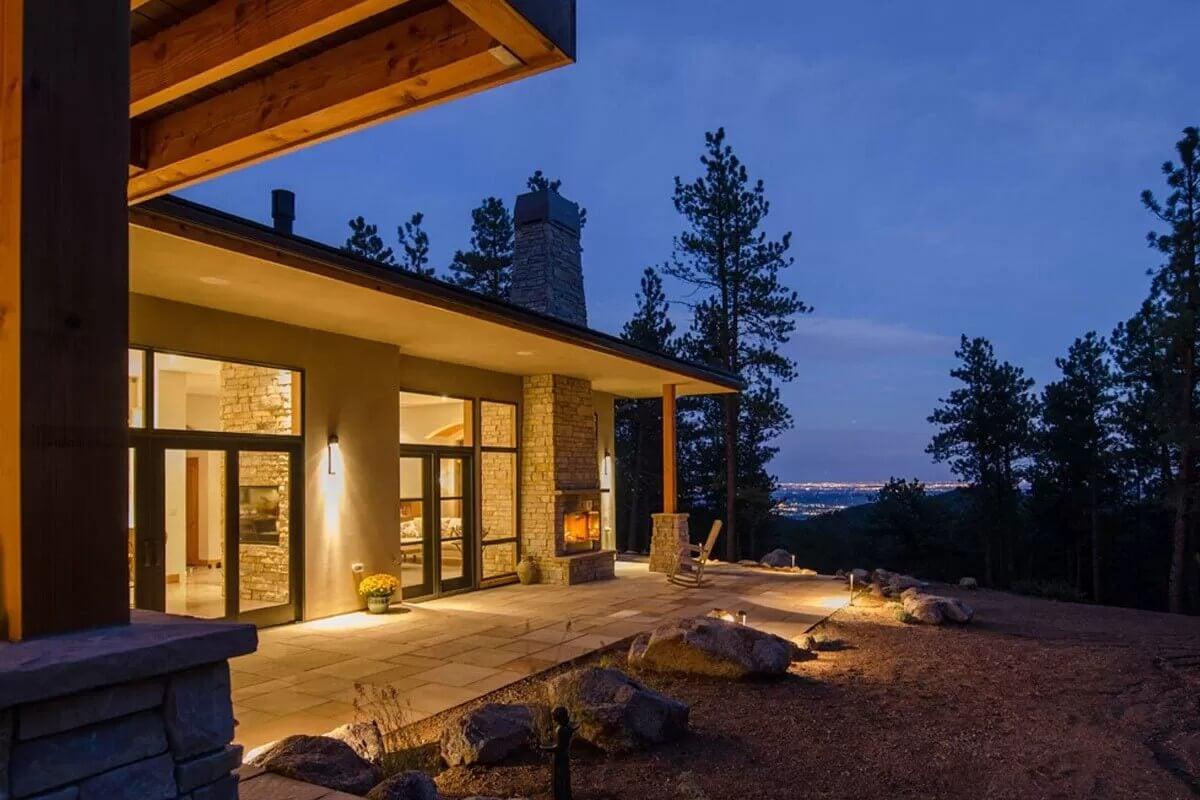 The Magic of Evening Light: Stone Fireplace and Inviting Patio