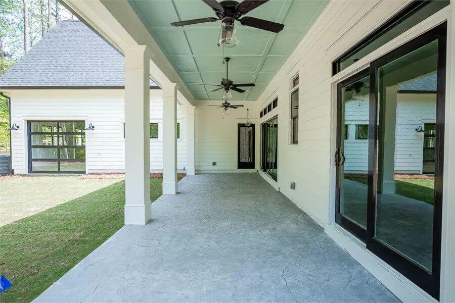 Covered Patio with Elegant Ceiling Fans and Smooth Transitional Spaces