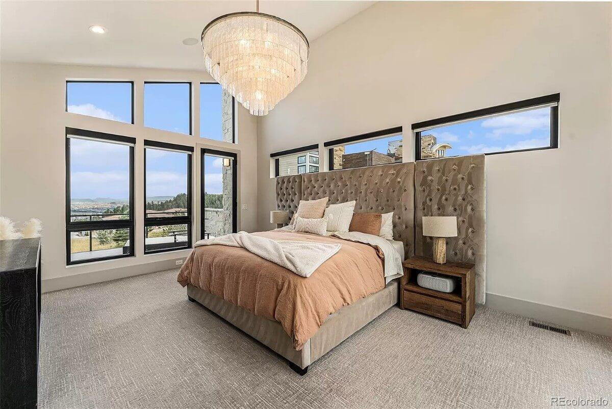 Look at That Oversized Chandelier in This Bright Bedroom