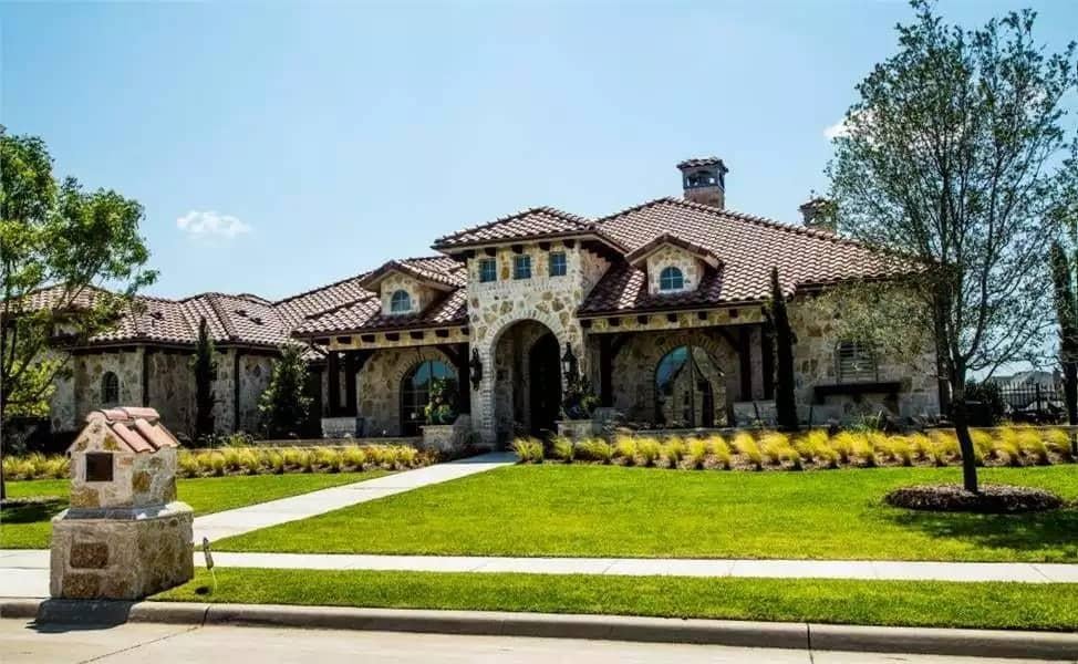 Marvel at the Stone Facade and Terracotta Roof of This Sprawling Home
