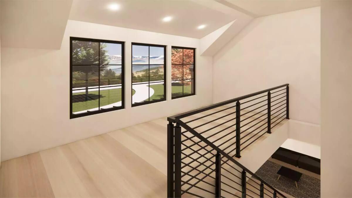 Enjoy the Scenic View from This Bright Stairway with Black Railings