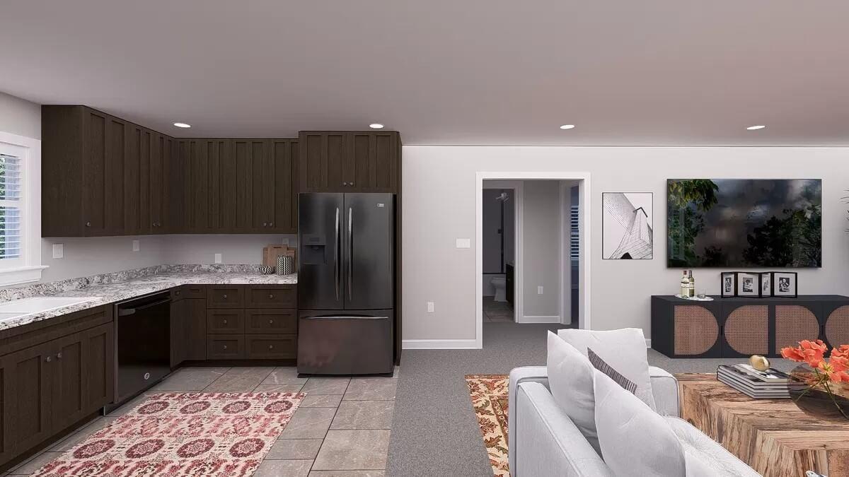 Look at How Dark Cabinetry and a Patterned Rug Define This Open Space